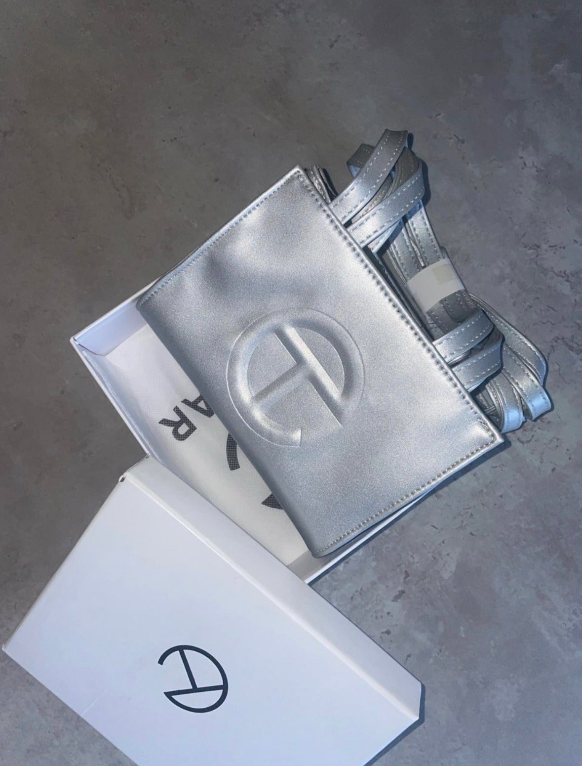 Silver tel crossbody bag