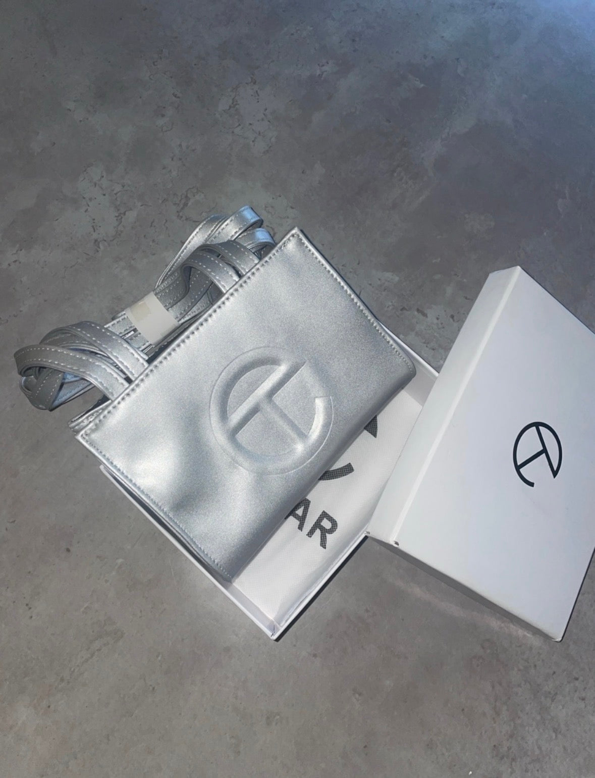 Silver tel crossbody bag