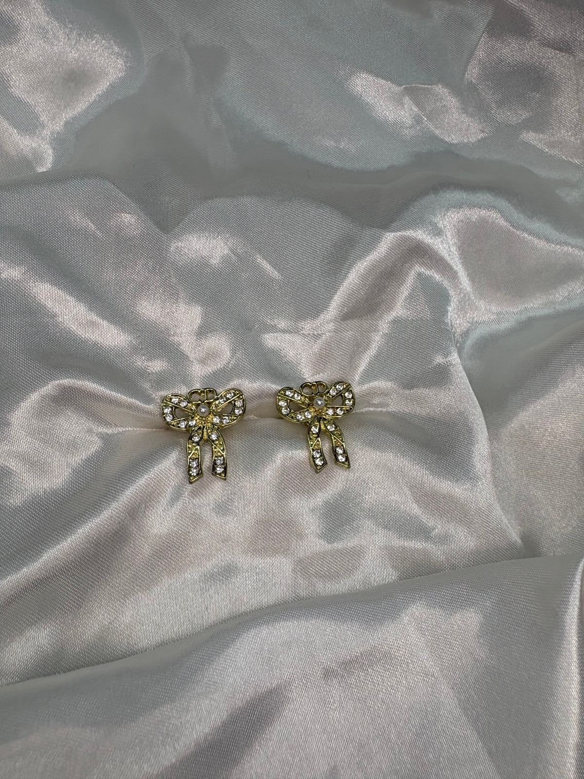 Gold diamanté DD bow earrings